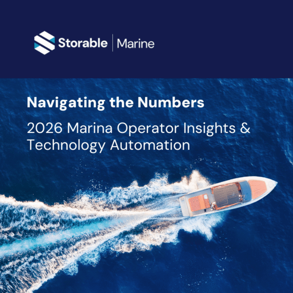 Aerial view of a boat gliding through blue water with white wake, featuring text about 2026 marina operator insights and technology automation by Storable Marine.