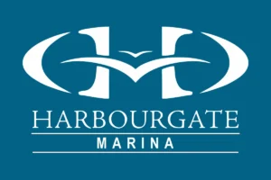 Logo for Harbourgate Marina featuring stylized white "H" and "M" with a bird shape, set against a teal background, with "HARBOURGATE MARINA" written below in white uppercase letters.