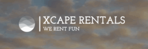 Logo for Xcape Rentals with the tagline "We Rent Fun" shown over a cloudy sky background. A circular wave icon is on the left of the company name.