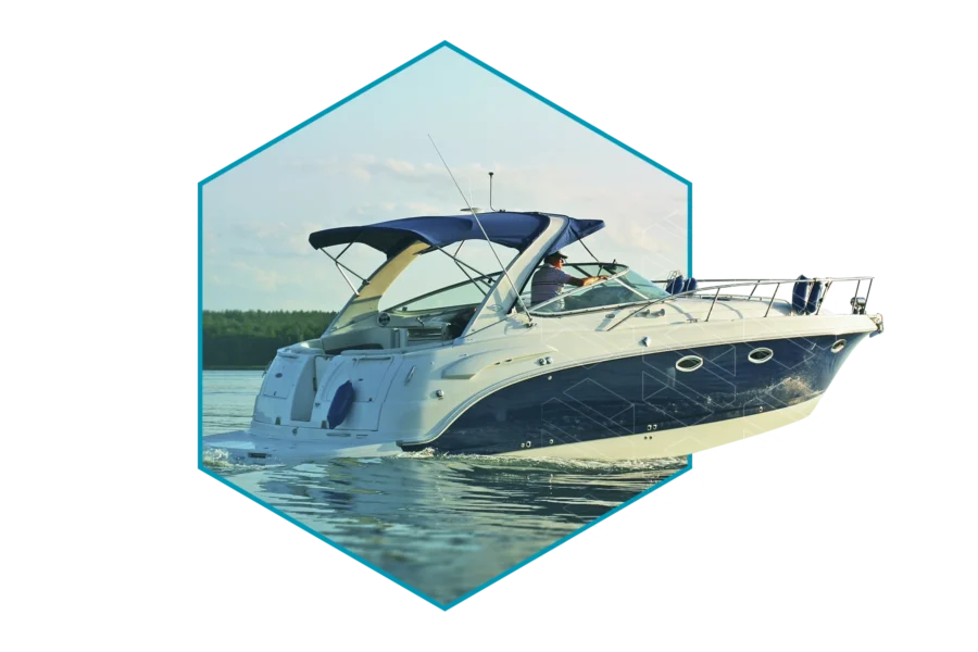 A blue and white motorboat cruises on calm water, framed within a hexagon border, with trees visible in the background—perfect for showcasing marina management software in action.